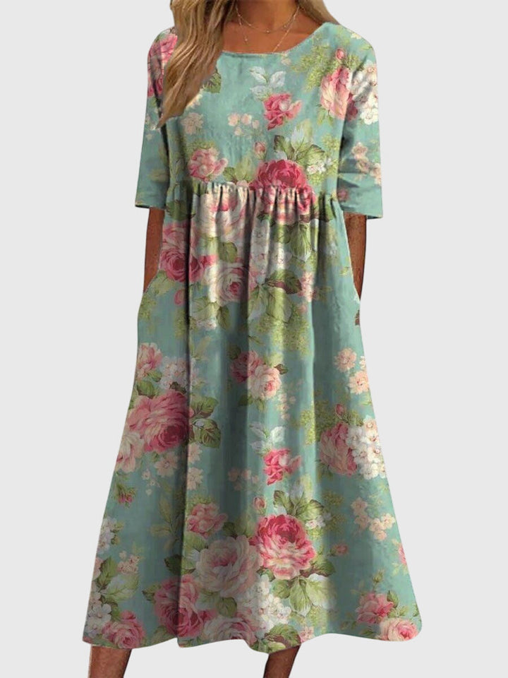Comfortable women's flowy midi dress with intricate embroidery, ideal for stylish casual wear or events.