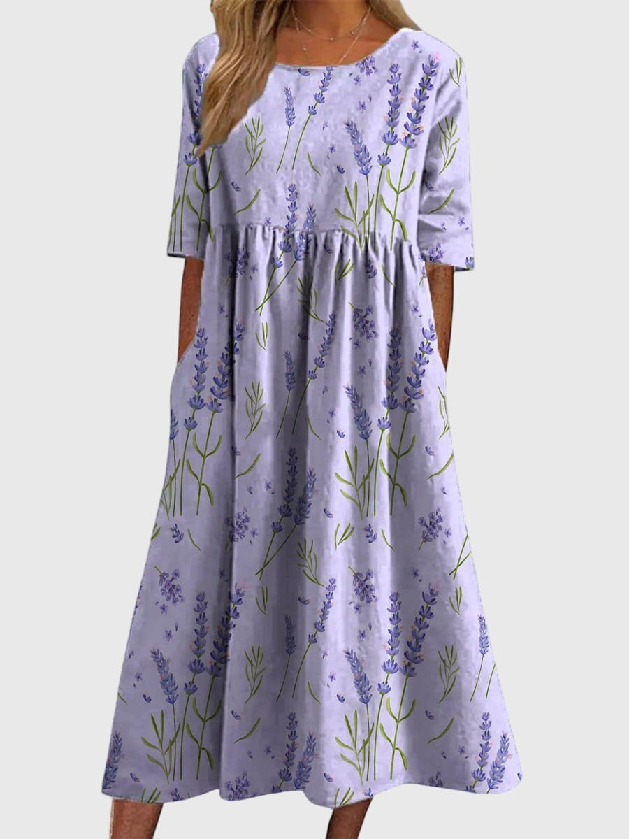 Delicate embroidered details on a soft, flowy women's midi dress, designed for elegance and ease.