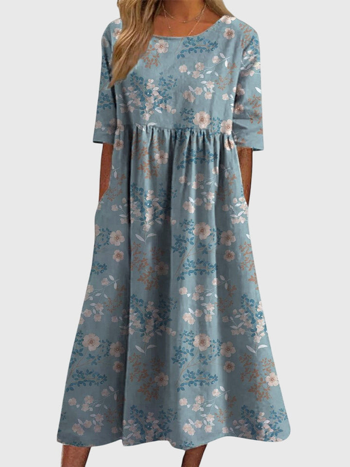 Beautifully embroidered women's flowy midi dress, offering elegant comfort for any fashion-forward look.
