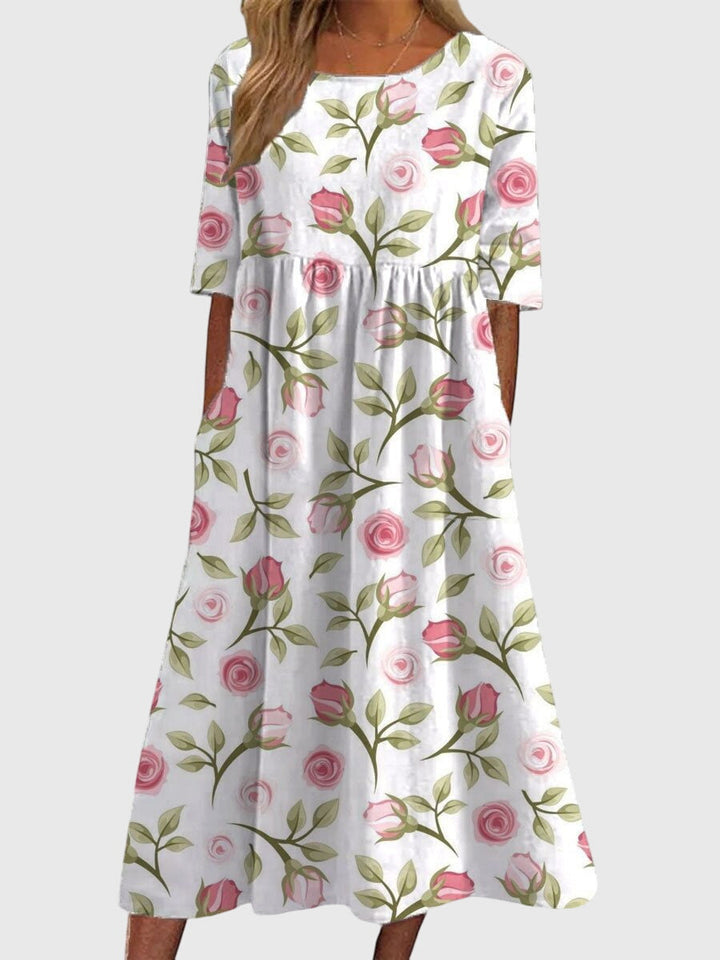 Chic women's embroidered flowy midi dress, combining elegant design with comfortable wear for all seasons.