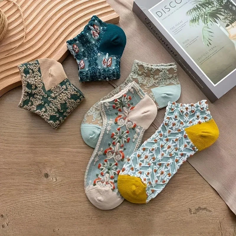 Chic women's mid-calf lace socks with intricate embroidery. Breathable, durable, & comfortable footwear.