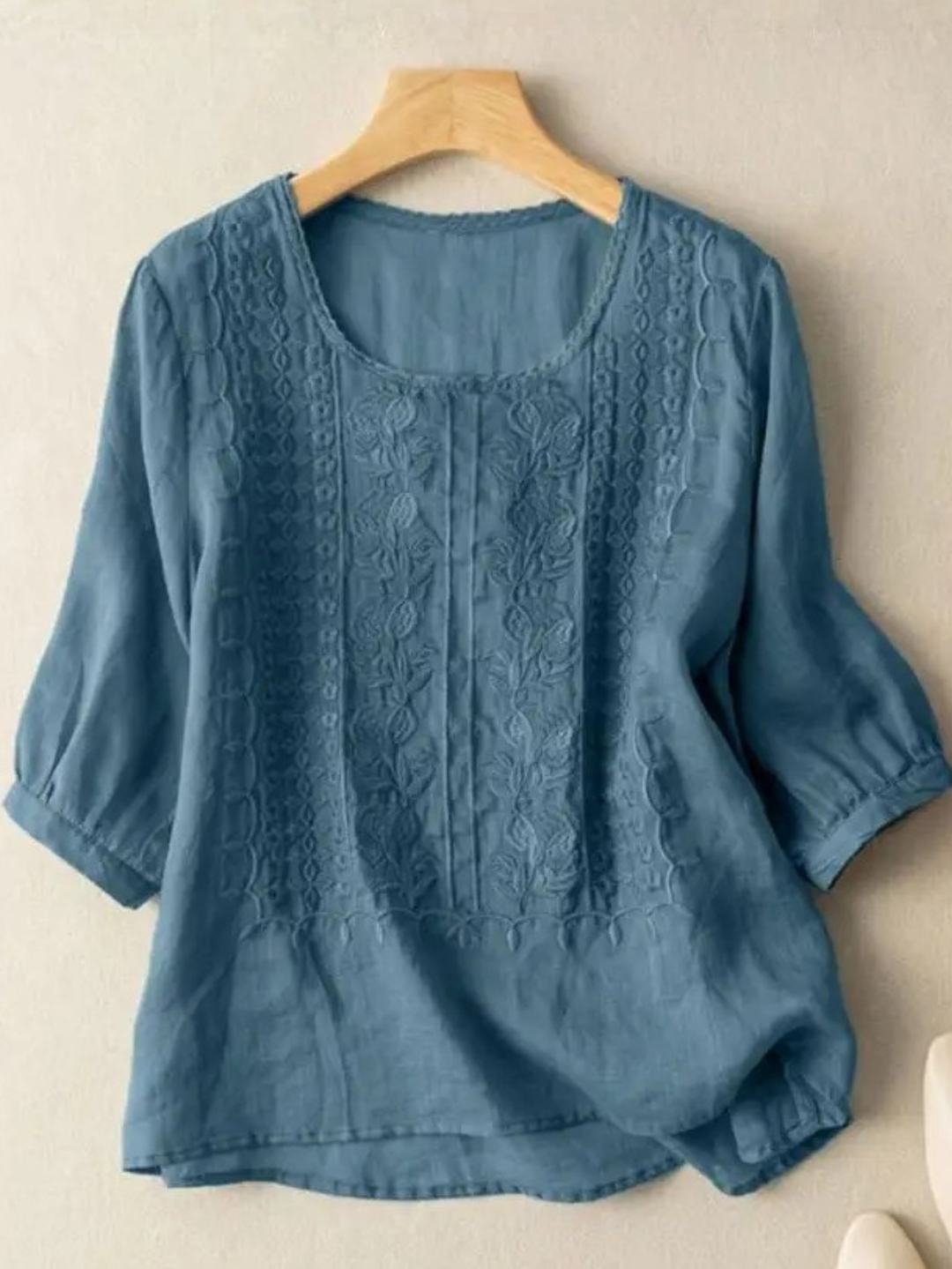Relaxed fit women's blouse with delicate embroidery, a versatile and comfortable fashion top.