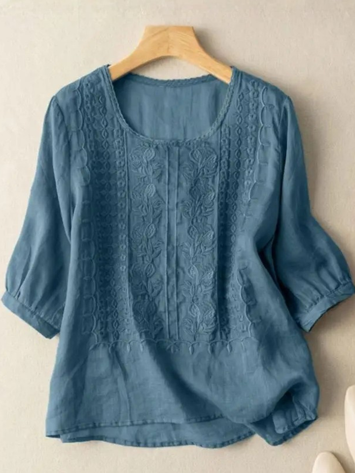 Relaxed fit women's blouse with delicate embroidery, a versatile and comfortable fashion top.