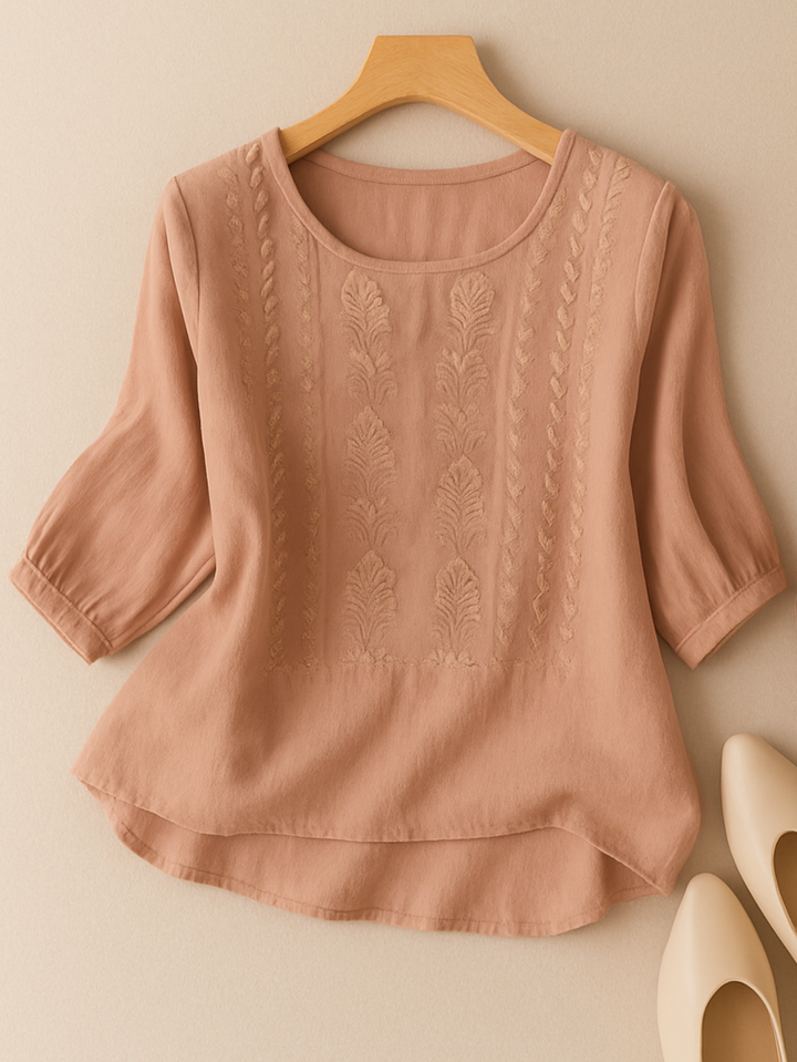Stylish women's long sleeve embroidered blouse, offering an elegant look and relaxed comfort.