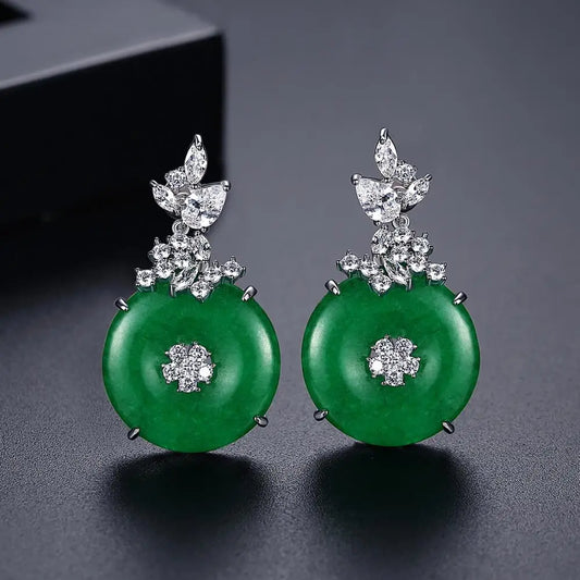 Elegant women's emerald green gemstone drop earrings in stainless steel, perfect for a luxurious fashion statement.