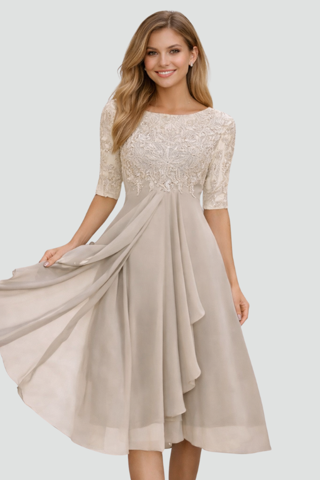 Formal women's midi dress featuring three-quarter sleeves and a flowing silhouette, ideal for evening events.