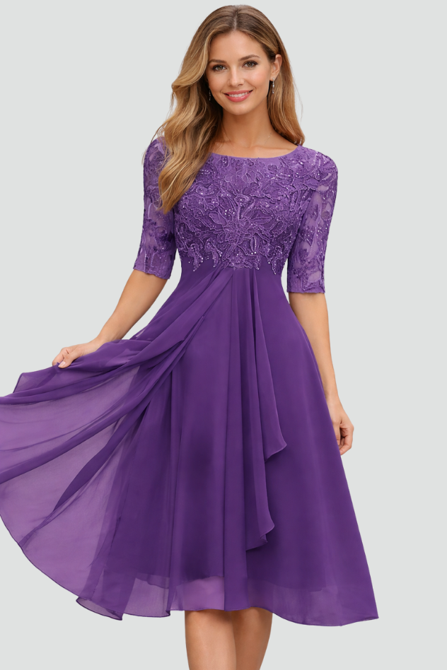 Flowing elegant midi dress for women, a sophisticated evening or cocktail party outfit with three-quarter sleeves.
