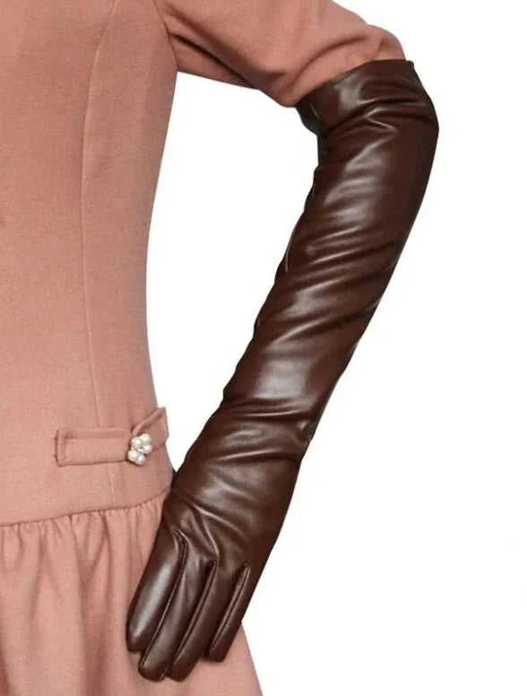 Chic elbow-length faux leather gloves for women. Elegant and versatile fashion accessory.