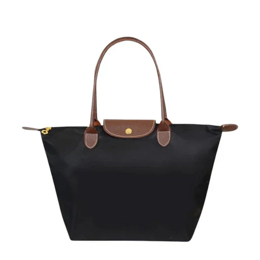 Elegant women's faux leather shoulder bag, perfect for everyday use. Spacious & organized fashion accessory.