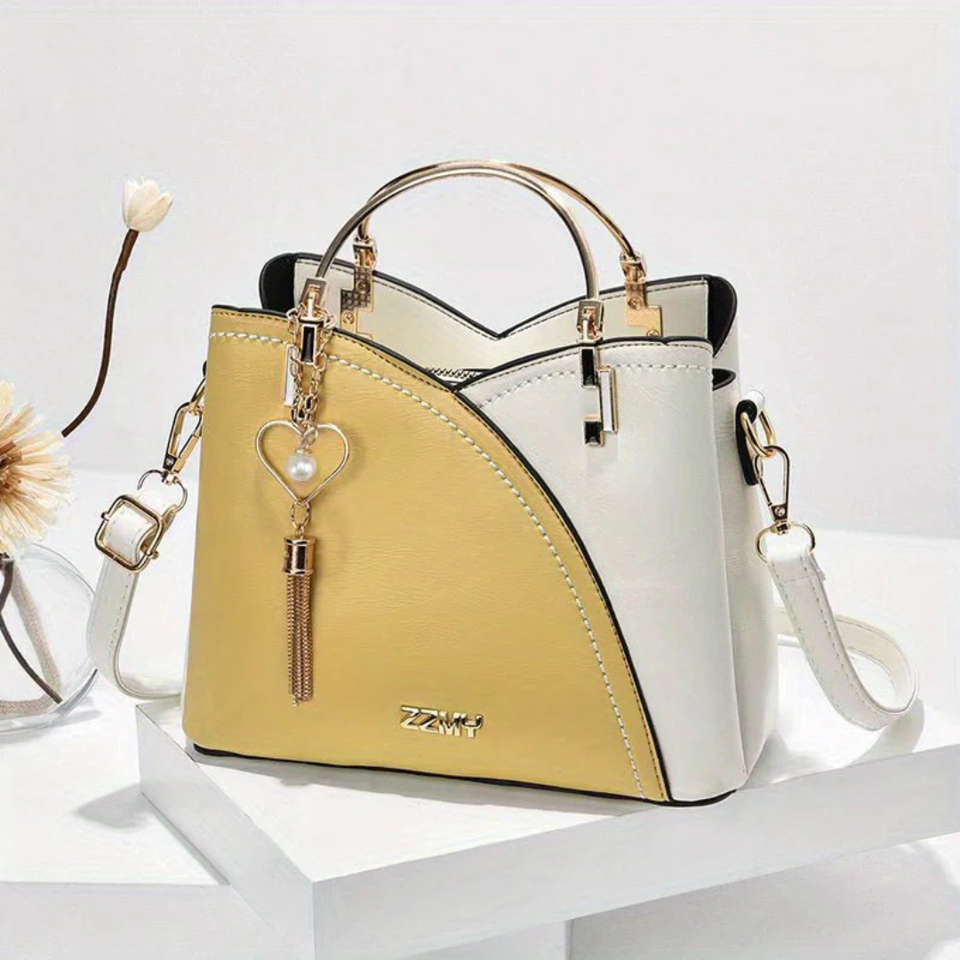 Chic faux leather ladies' shoulder bag with elegant design, perfect for fashion statements.
