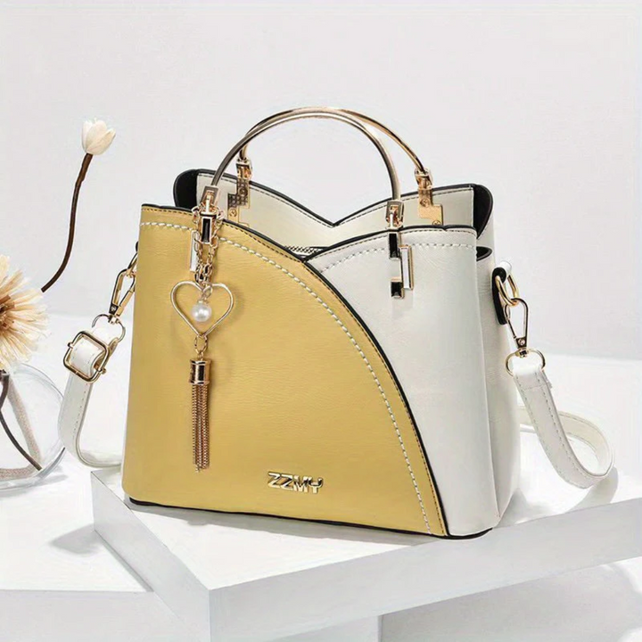 Chic faux leather ladies' shoulder bag with elegant design, perfect for fashion statements.
