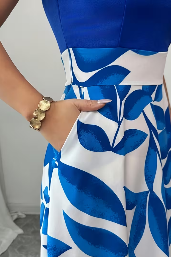 Sophisticated women's floral A-line maxi dress with V-neck design and essential pockets for versatile summer style.