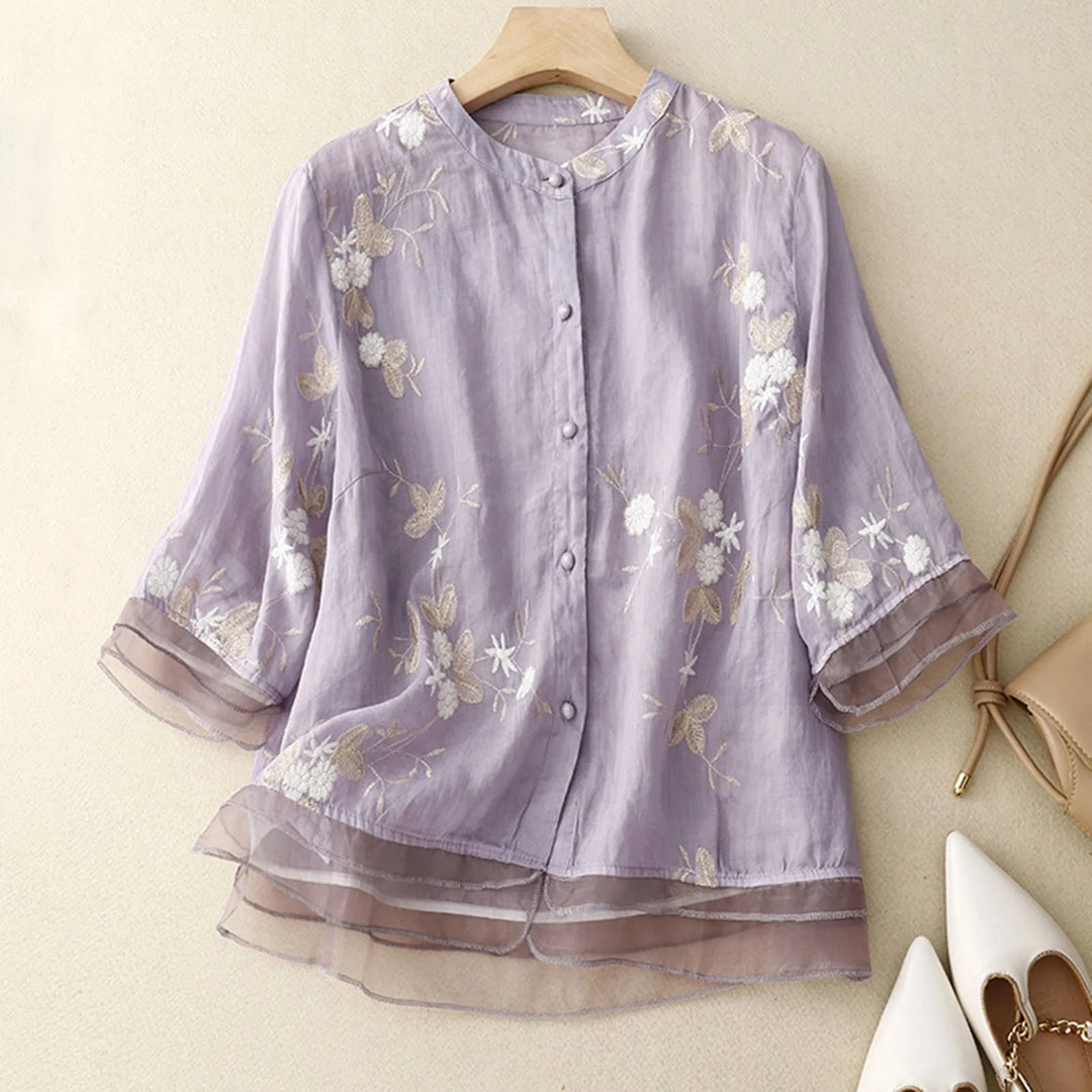 Elegant women's floral bloom blouse, perfect for spring fashion. Chic & stylish daytime wear.