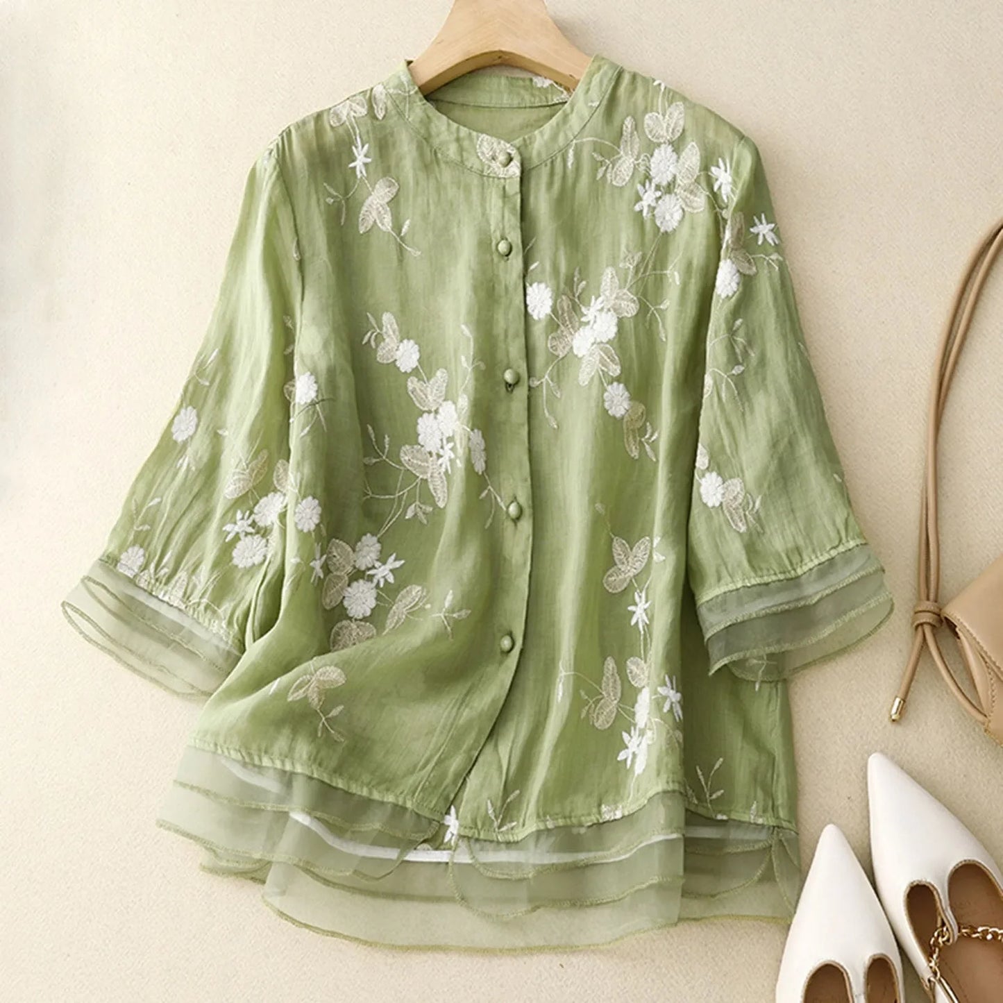 Sheer embroidered floral blouse for women. Romantic summer style, elegant and chic apparel.