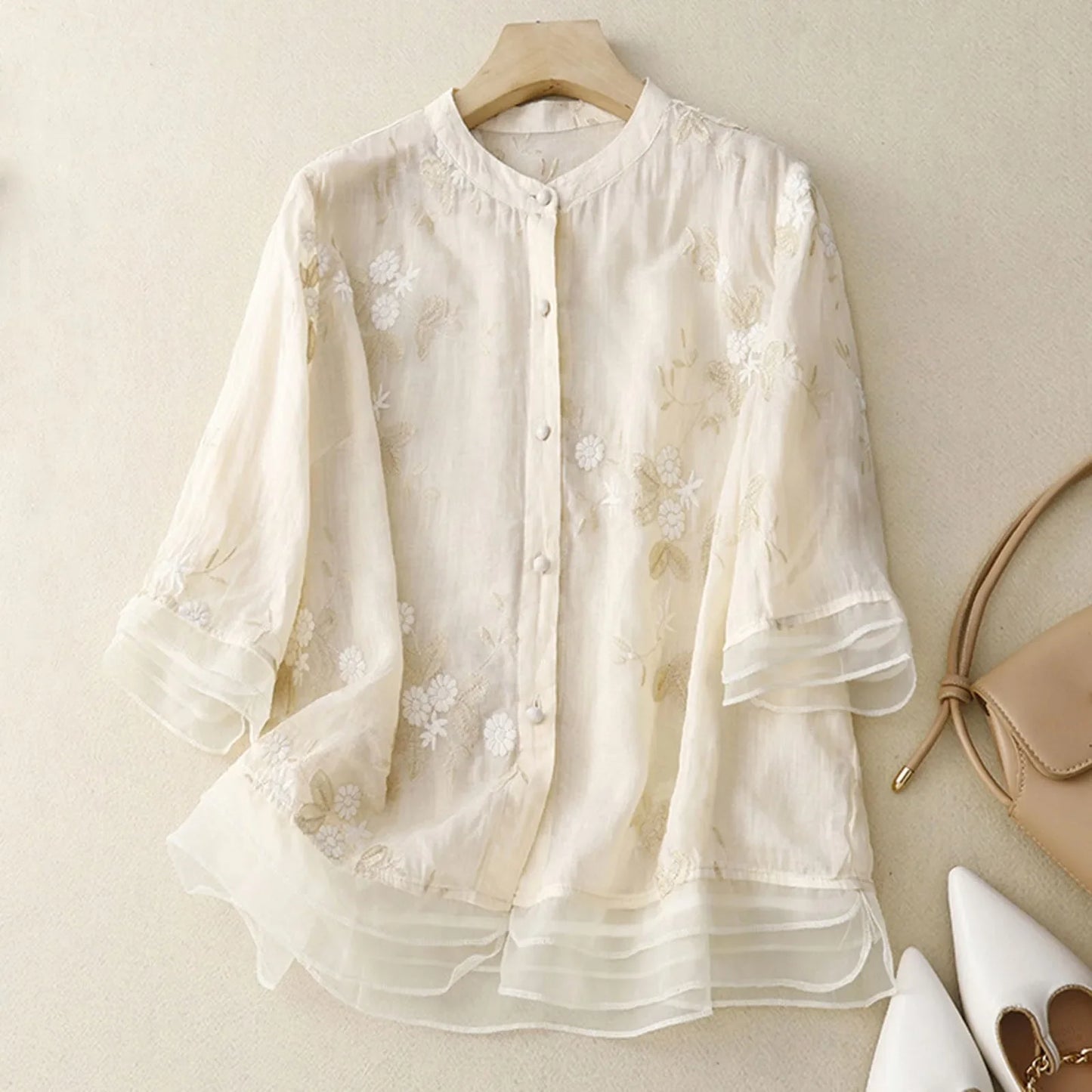 Women's floral bloom blouse with intricate embroidery. Ideal elegant top for spring & summer fashion.