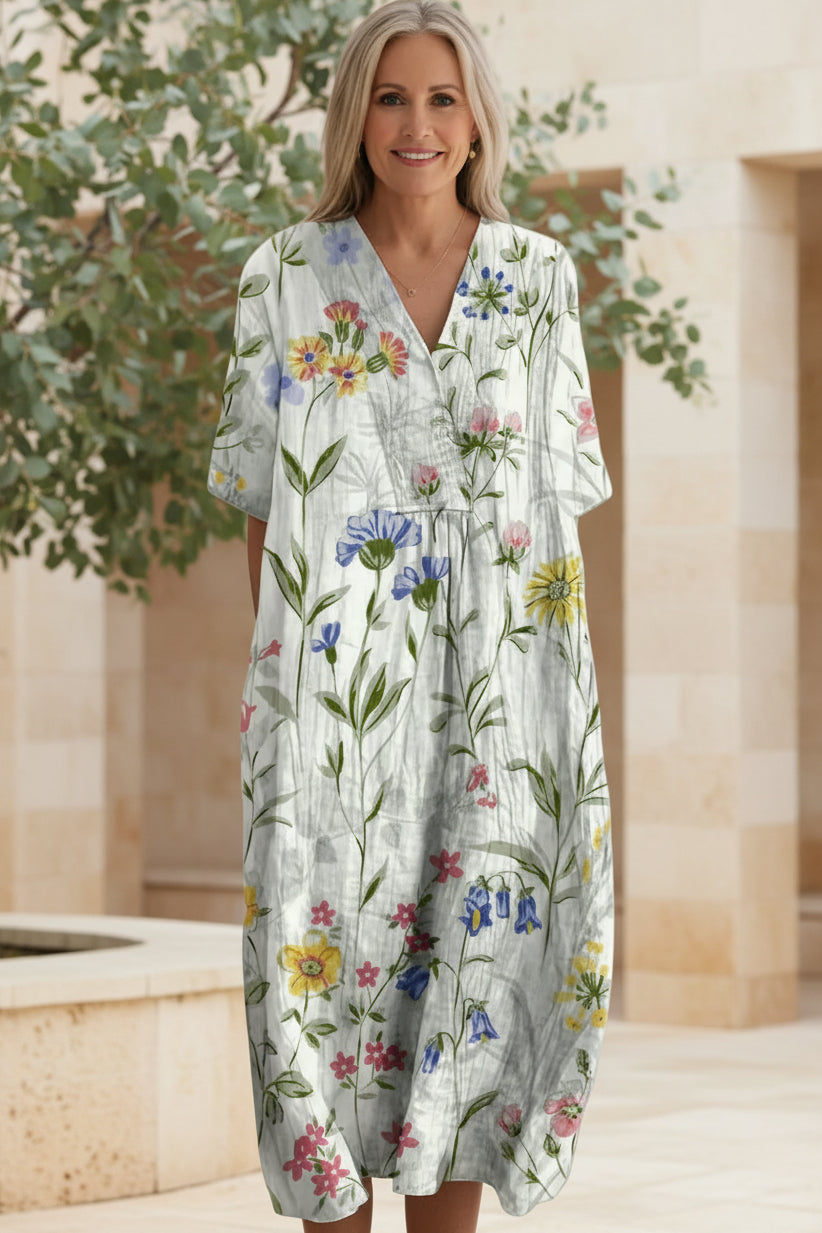 Model wearing versatile Women's Floral Bloom V-Neck Maxi Dress, flowy and comfortable for summer days.
