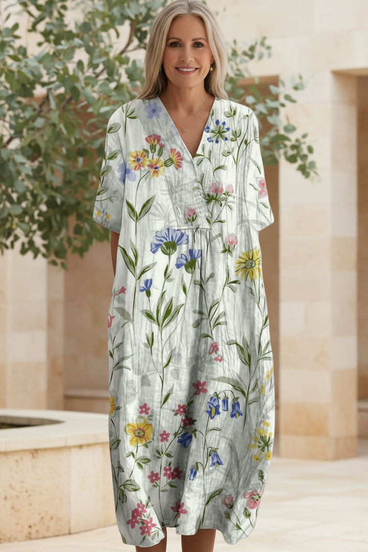 Model wearing versatile Women's Floral Bloom V-Neck Maxi Dress, flowy and comfortable for summer days.