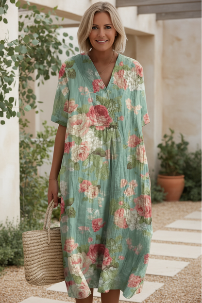 Women's elegant floral V-neck maxi dress styled with accessories. Comfortable, short-sleeve, perfect for summer vacation.
