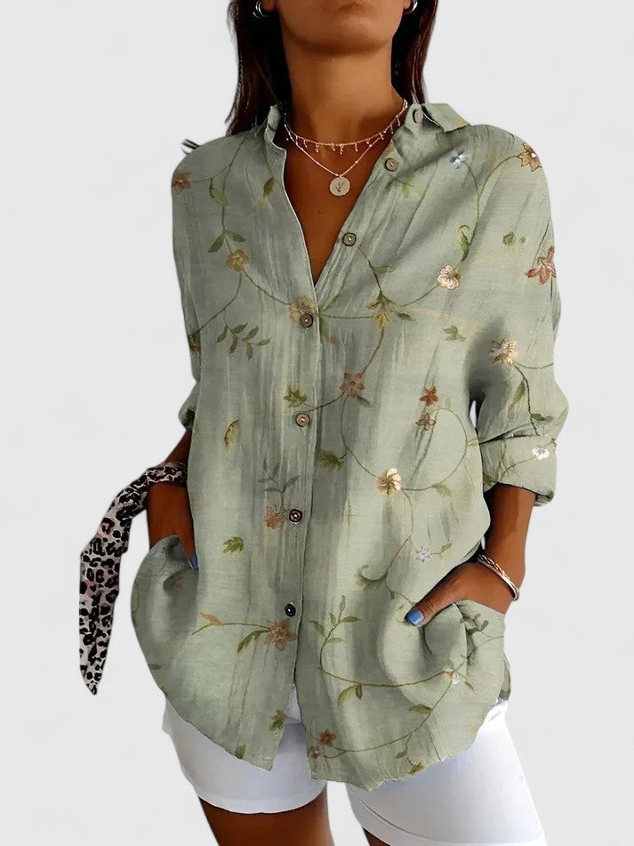 Women's elegant floral blouse, a versatile all-season top for both casual and professional settings.