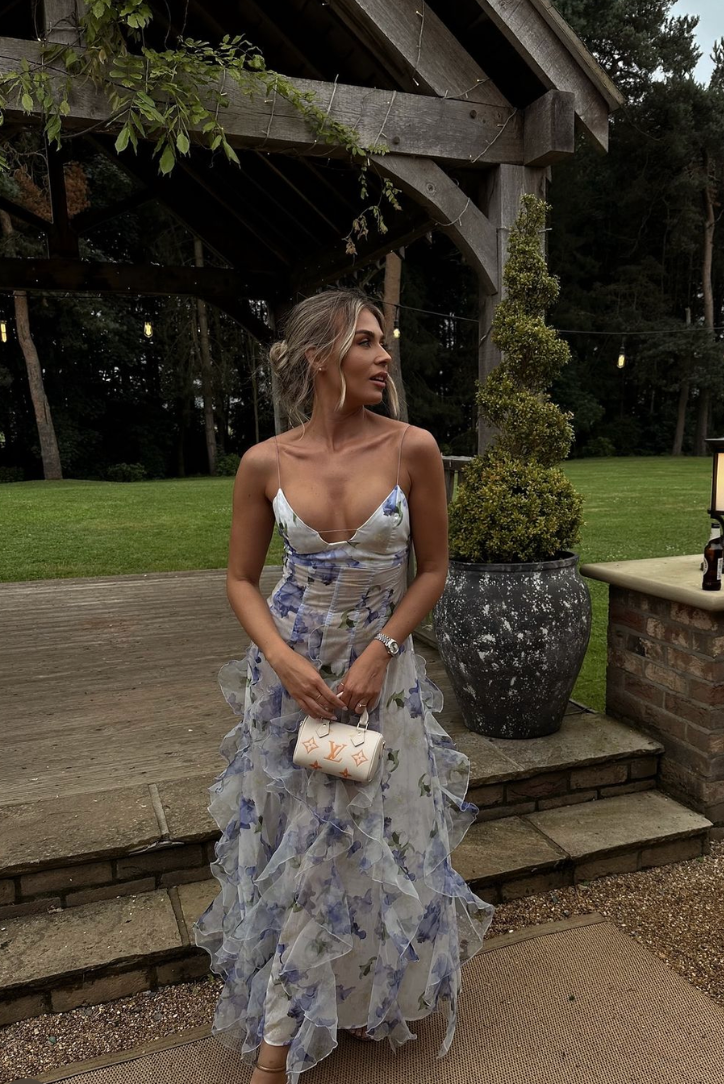 Detailed view of the blue floral print on this women's elegant corset ruffle maxi wedding guest dress.
