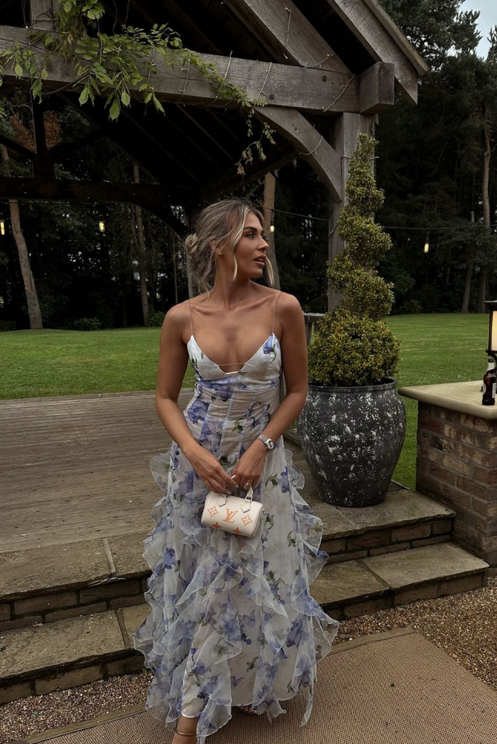 Detailed view of the blue floral print on this women's elegant corset ruffle maxi wedding guest dress.