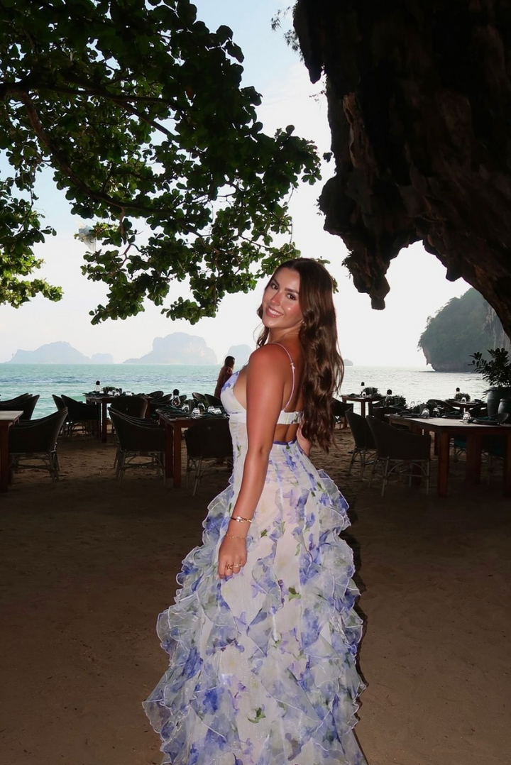 Women's blue floral corset ruffle maxi dress. Elegant V-neck wedding guest and garden party formal summer attire.