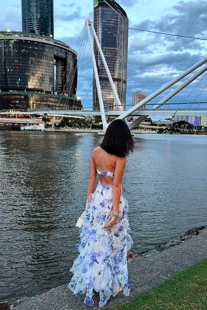 Stylish women's floral print maxi dress with corset, ruffles, and V-neck. An elegant blue wedding guest choice.