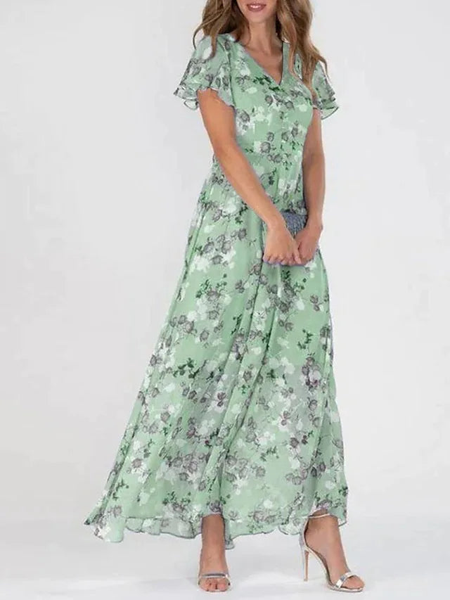 Flowy floral maxi dress for women with flutter sleeves & V-neck, ideal as an elegant wedding guest or party dress.