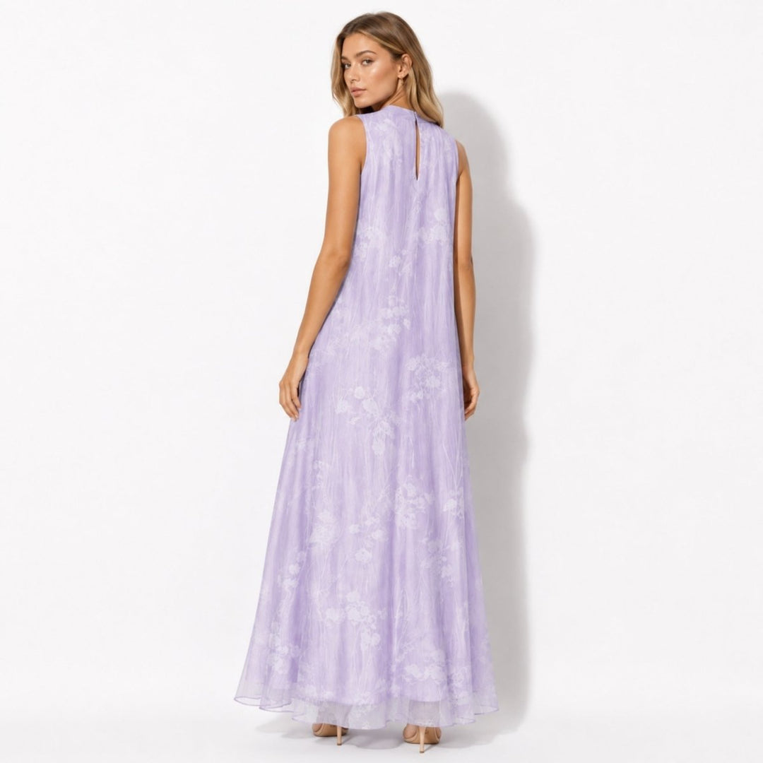 Model wearing a flowing women's floral high neck maxi dress, suitable long formal gown for wedding guests.