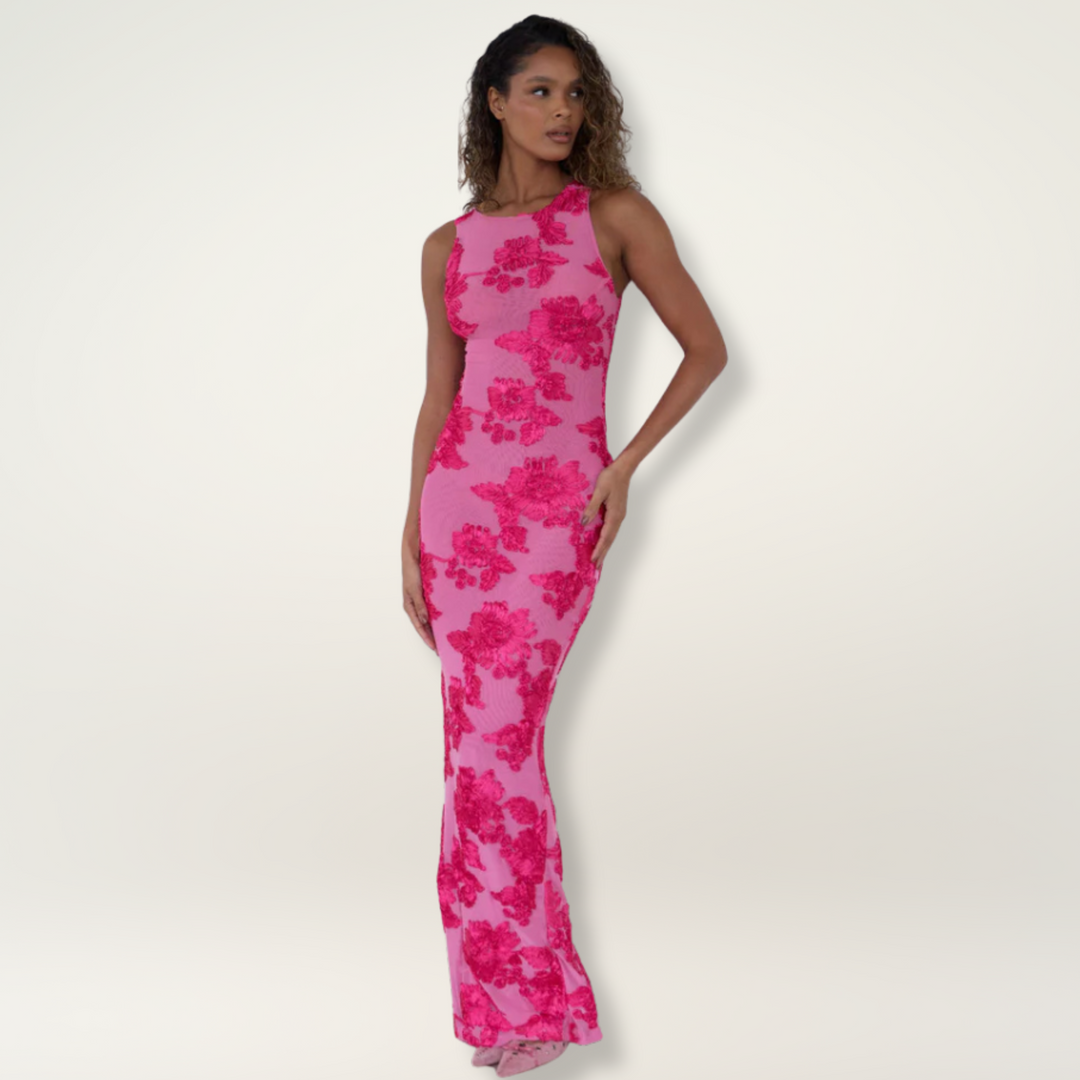 Pink floral high-neck maxi dress for wedding guests. Fitted sleeveless column gown, elegant and special occasion wear.