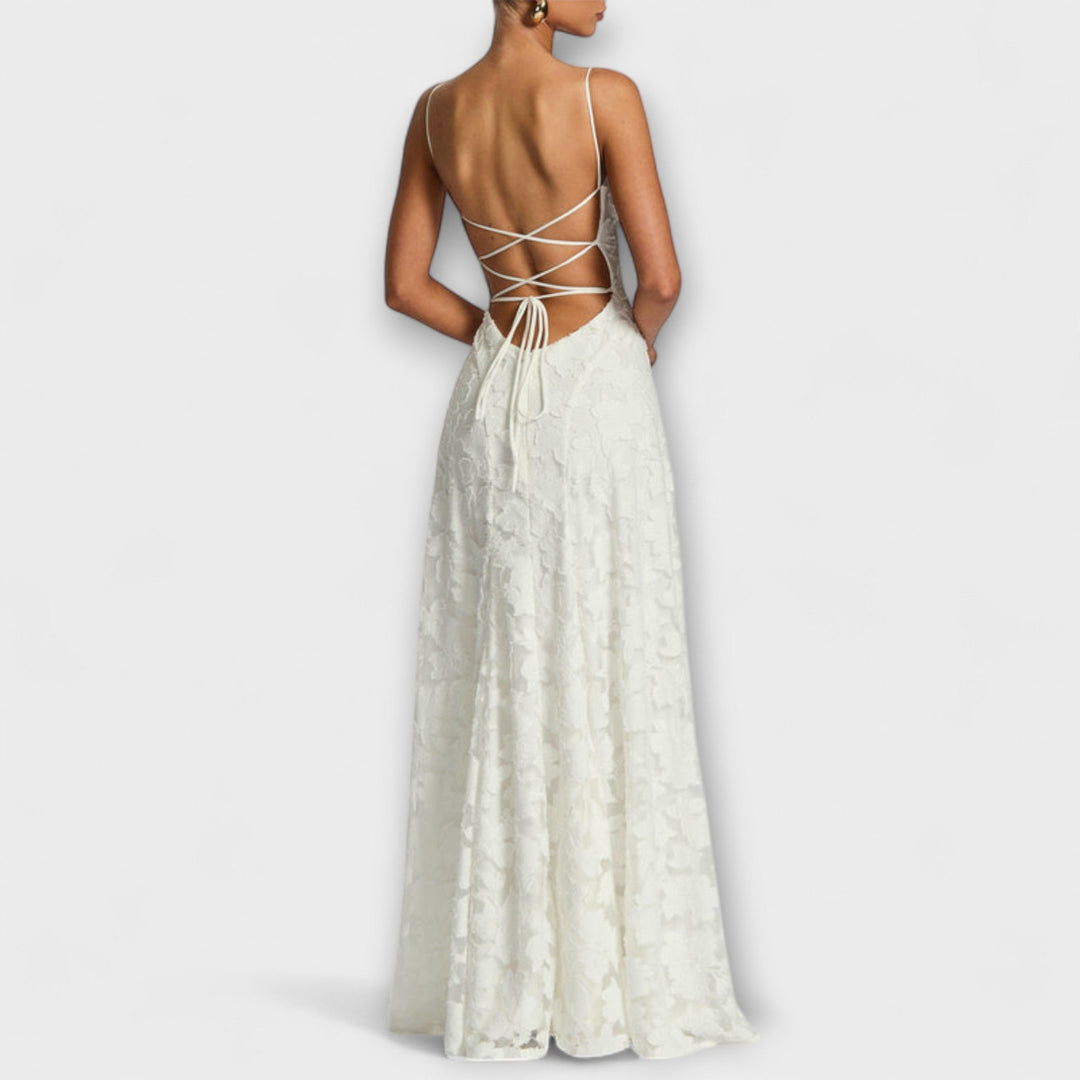 Romantic A-line floral lace maxi dress with spaghetti straps. Ideal for summer evening events & formal parties.