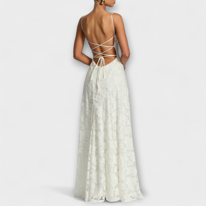 Romantic A-line floral lace maxi dress with spaghetti straps. Ideal for summer evening events & formal parties.