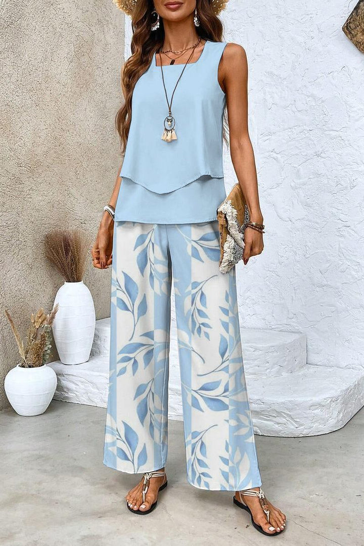 Elegant women's floral matching top and trouser set. Stylish two-piece outfit for spring and summer casual wear.