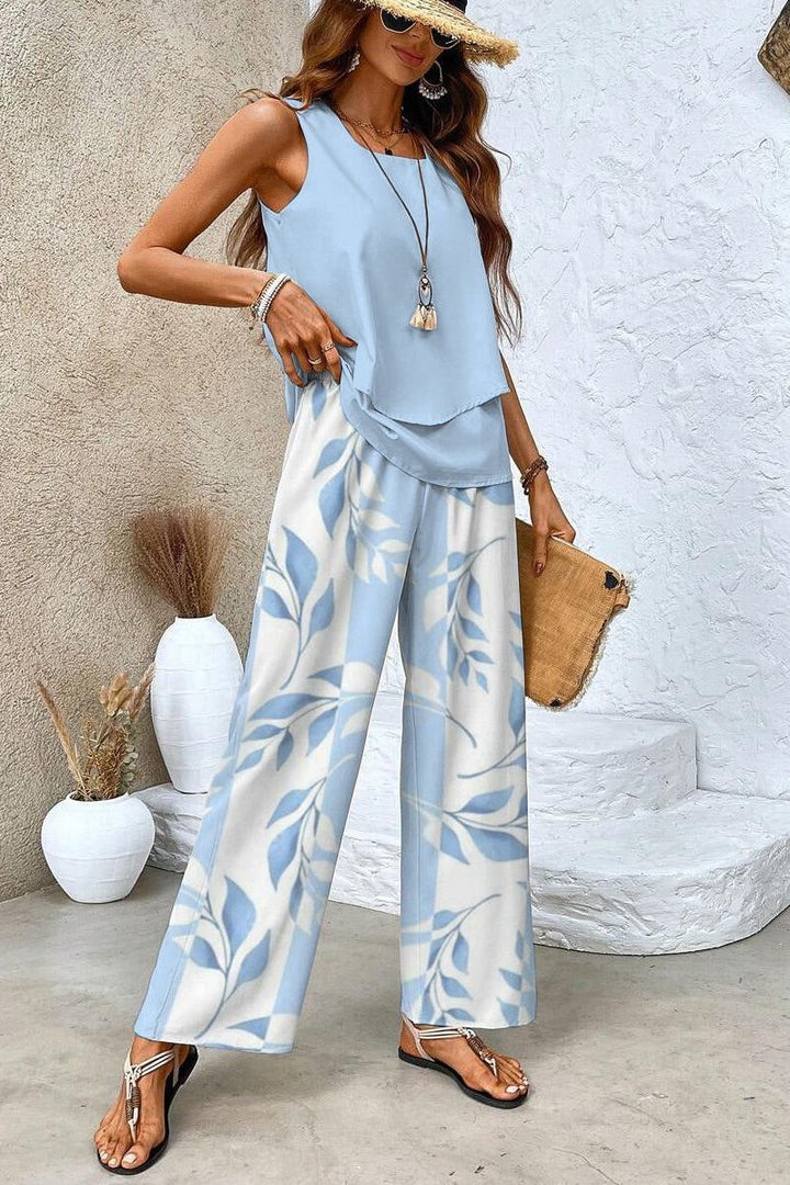 Comfortable women's floral print top and matching trousers. Chic spring-summer outfit for effortless style.