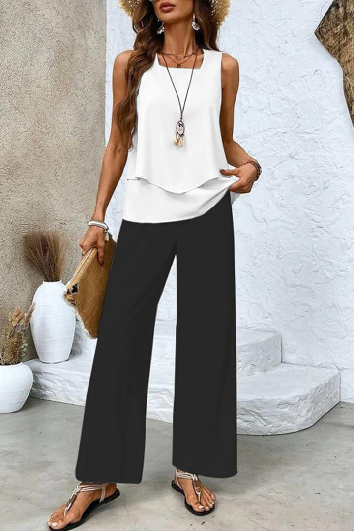 Complete women's floral two-piece outfit: stylish top & comfortable trousers. Ideal for spring/summer casual.