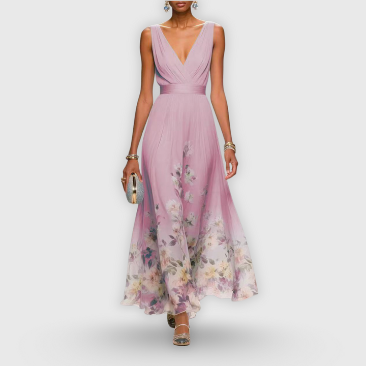 Stylish sleeveless floral maxi dress for women, featuring a V-neck, pleated A-line skirt. Elegant formal wear.