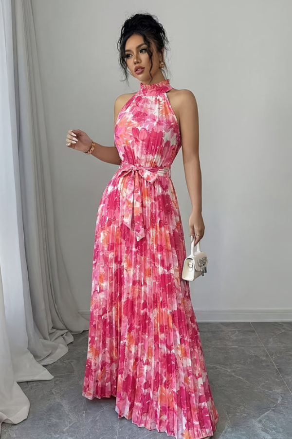 Chic women's sleeveless floral maxi dress featuring a halter neck and keyhole, ideal for elegant summer events.