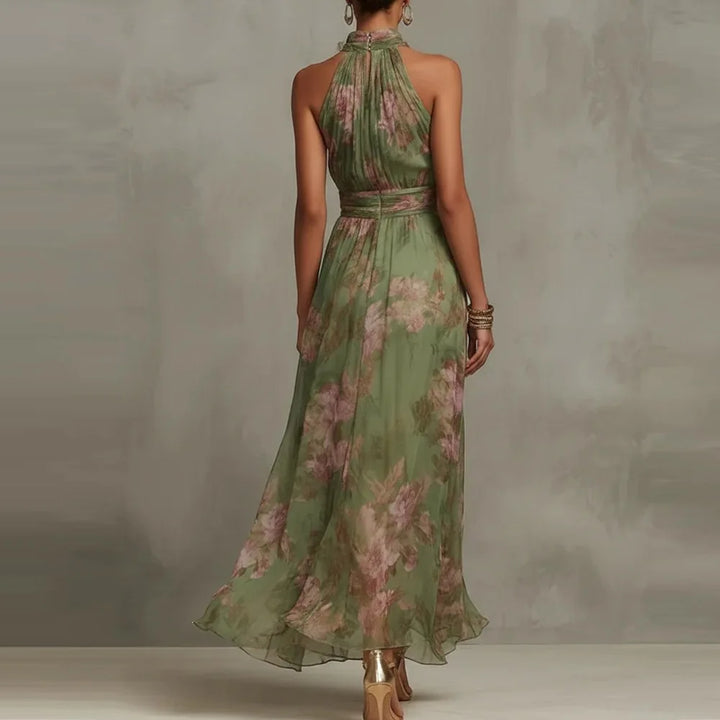 Flowing floral maxi dress for women, elegant sleeveless design with a halter neck & ruched waist for special occasions.