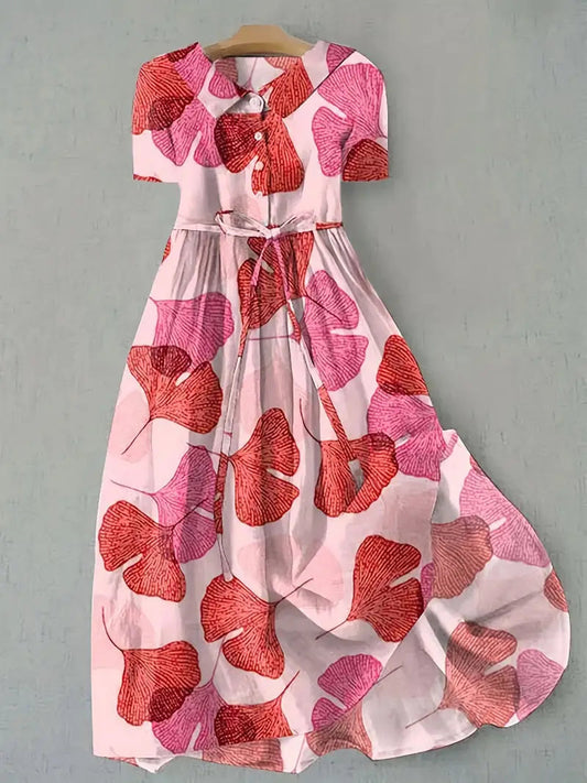 Elegant women's floral midi dress for summer, featuring short sleeves and comfortable fabric, perfect for casual or day wear.