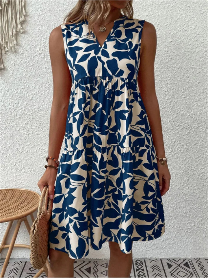 Flowy V-neck summer dress for women, featuring a vibrant floral print and comfortable A-line design.