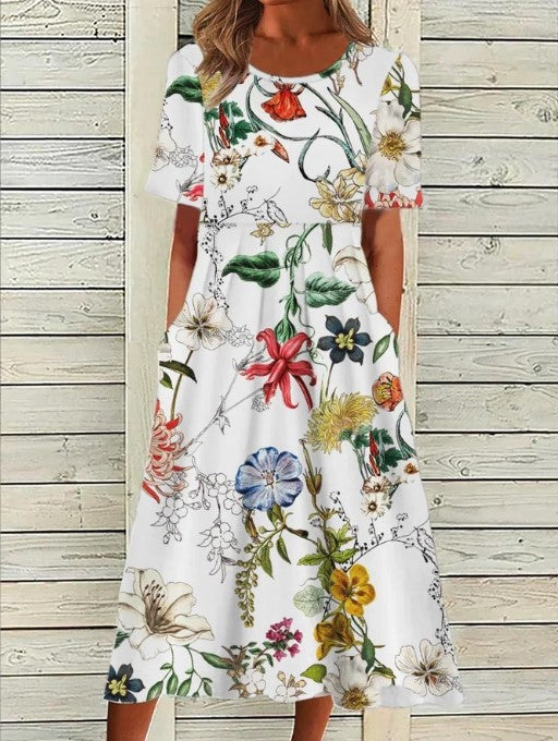 Flowy floral midi dress for women, featuring short sleeves & round neck. Ideal comfortable spring or summer casual wear.