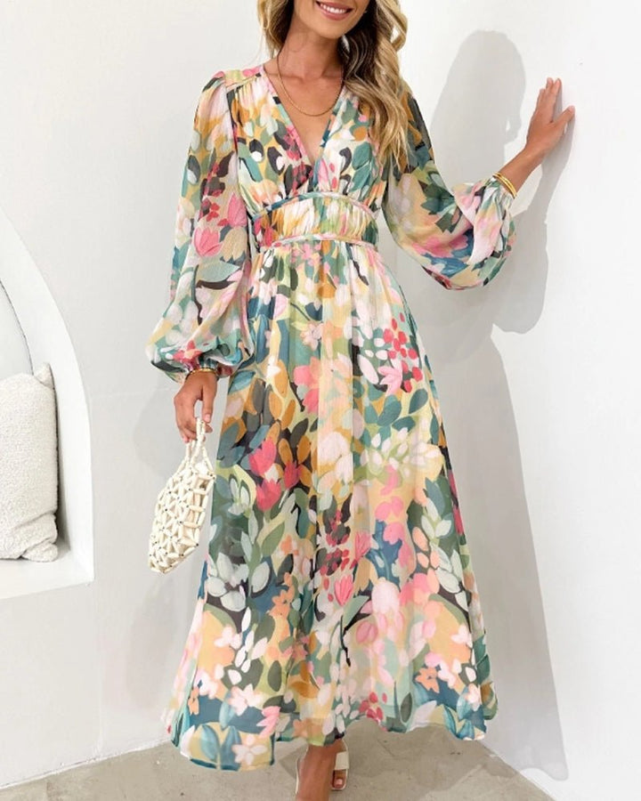 Chic floral midi dress for women, featuring a V-neck, long sleeves & belted waist, perfect for elegant occasions.