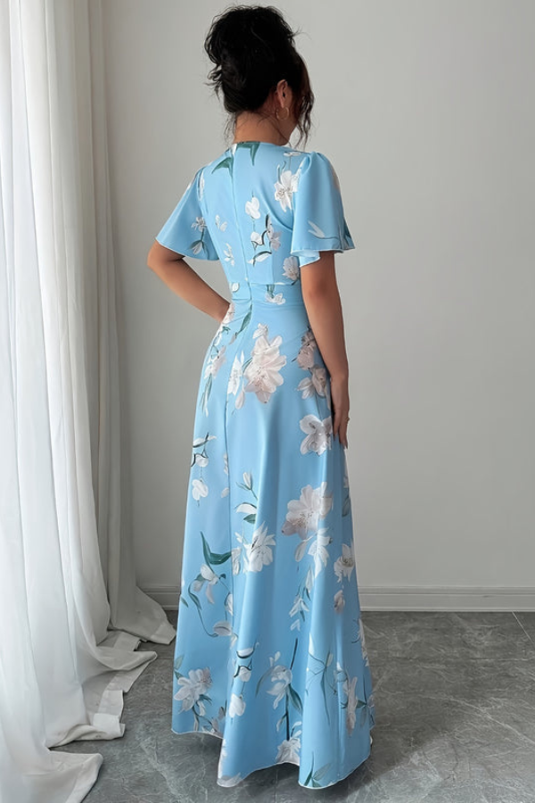 Women's elegant midi dress, vibrant floral print, retro pleated skirt, timeless summer fashion.