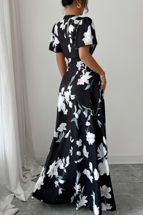 Women's elegant floral midi dress with a retro pleated skirt, ideal for summer day wear.