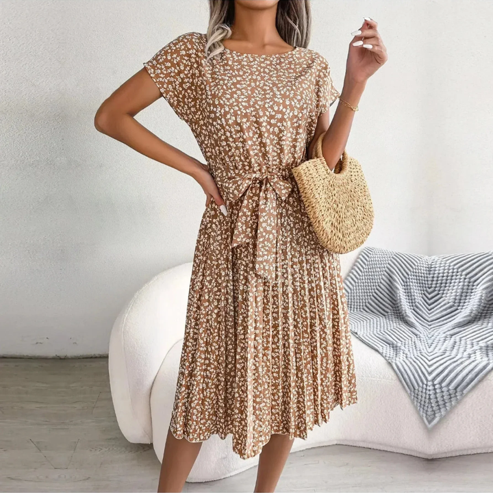 High-quality women's elegant floral pleated midi dress. Perfect for a chic and comfortable summer outfit.