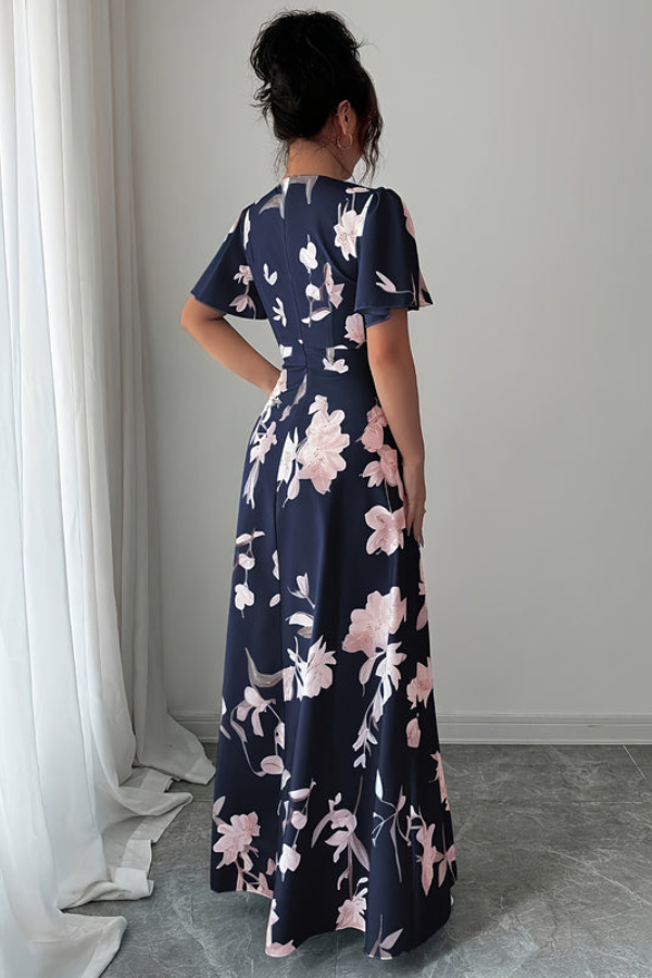 Chic women's floral midi dress, retro pleated design, ideal for elegant summer gatherings.