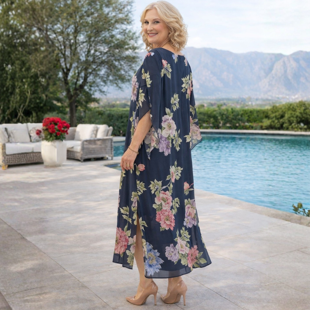 Vibrant floral print women's maxi dress, ideal for summer. A graceful, flowing long dress for warm weather style.