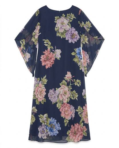 Stylish women's elegant maxi dress with a beautiful floral pattern. This long, flowing summer dress offers a sophisticated look.