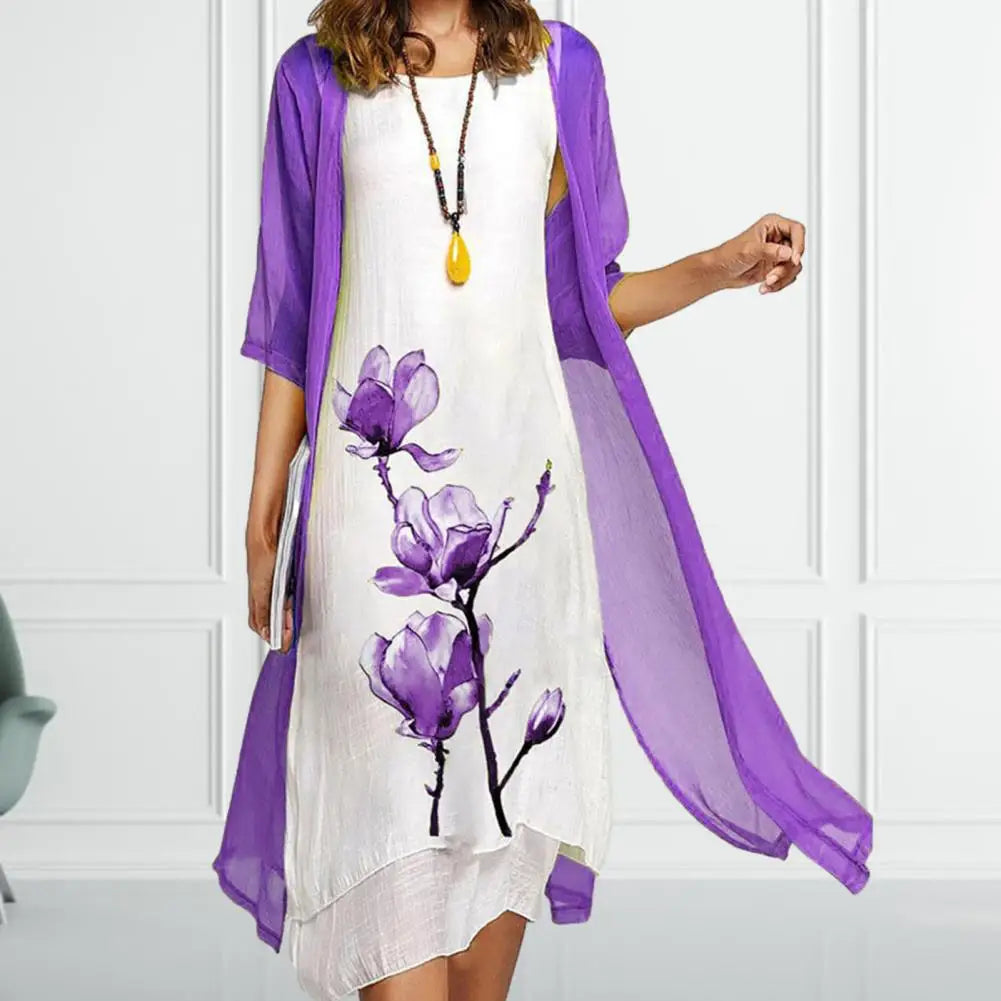 Close-up of a women's botanical floral print midi dress, part of an elegant two-piece layered set for summer.