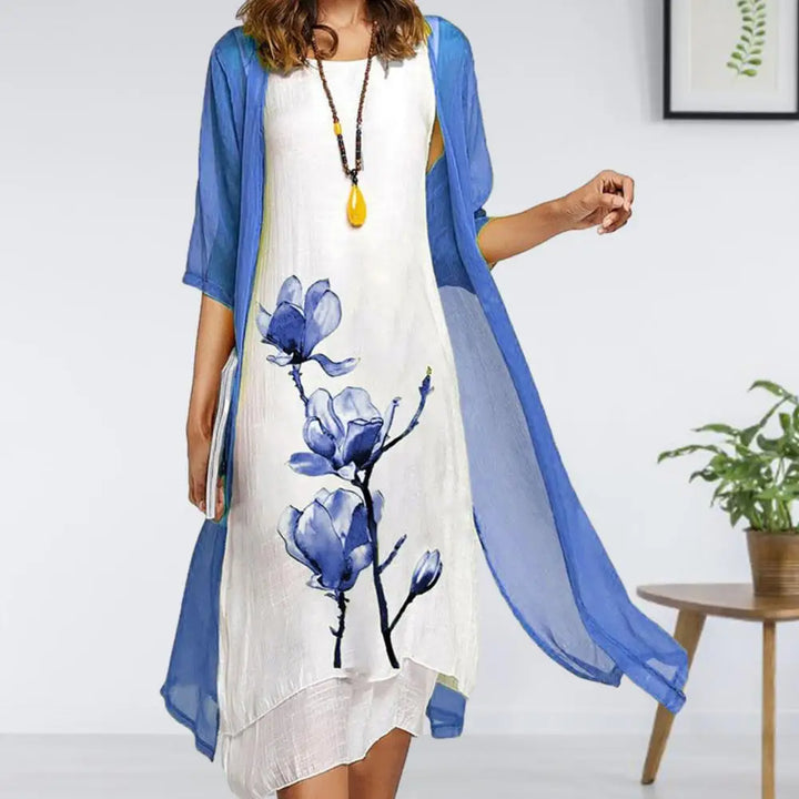 Chic women's two-piece floral print dress & cardigan set. Effortless layered style for spring, summer, or occasion wear.